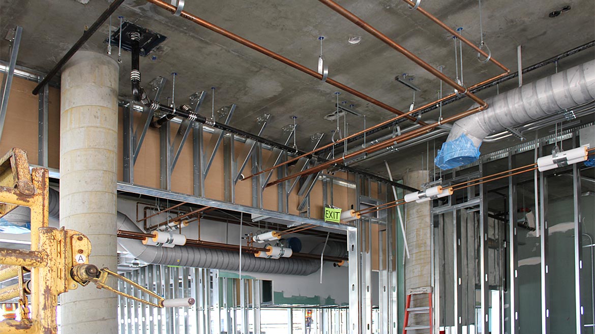 Cold-formed steel is easier than plumbing in this office's HVAC conversion project