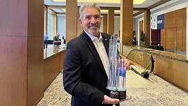Mike Taylor of Liddle Brothers holds the AWCI Pinnacle Award at BUILD25